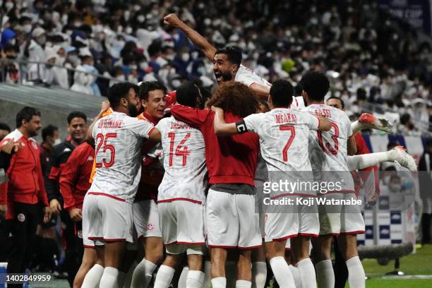Tunisia players celebrate their first goal scored by Mohamed Ali Ben Romdhane during the international friendly match between Japan and Tunisia at...