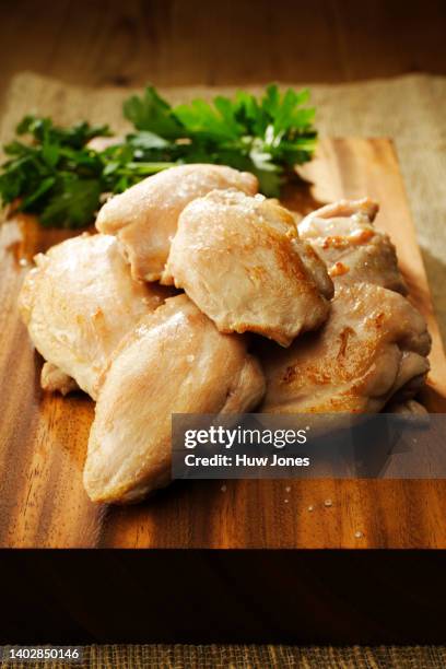 close up roasted skinless boneless chicken thighs - chicken thigh stock-fotos und bilder