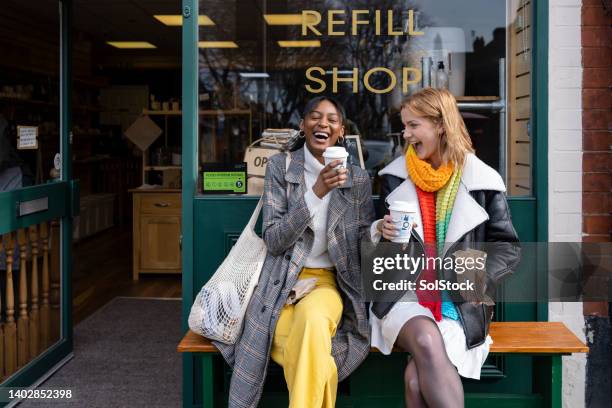 coffee and laughs - real people shopping stock pictures, royalty-free photos & images