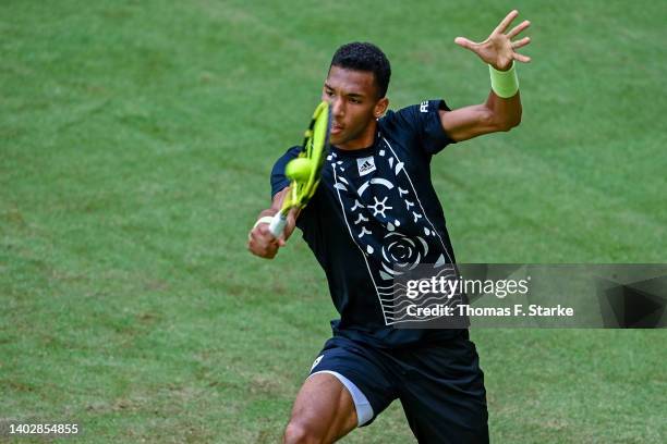 Felix Auger-Aliassime of Canada plays a backhand in his match against Marcos Giron of the United States during day four of the 29th Terra Wortmann...