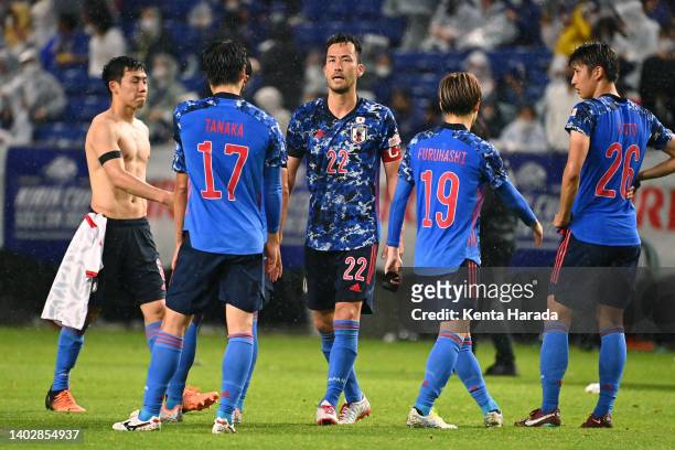 Japanese players react after their 0-3 defeat in the international friendly match between Japan and Tunisia at Panasonic Stadium Suita on June 14,...