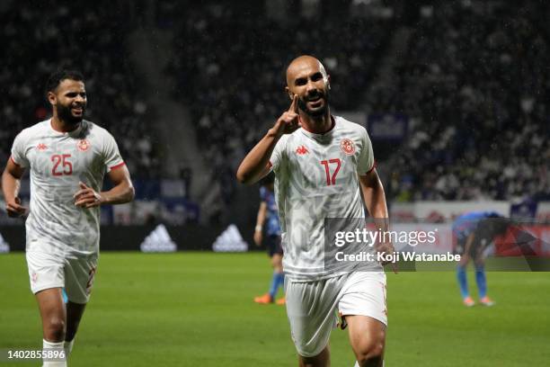 Issam Jebali of Tunisia celebrates scoring his side's third goal during the international friendly match between Japan and Tunisia at Panasonic...