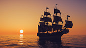 Warship Sailing The Sea At Dawn