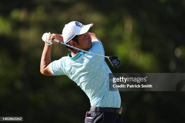Tomoyasu Sugiyama of Japan plays a shot on the third hole during a practice round prior to the US Open at The Country Club on June 14, 2022 in...