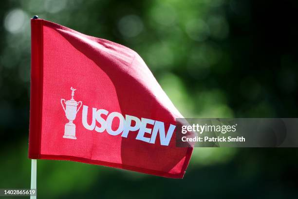 Flag with a U.S. Open logo blows in the breeze during a practice round prior to the US Open at The Country Club on June 14, 2022 in Brookline,...