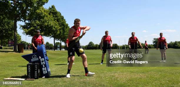 Owen Farrell plays the ball as the team warm up playing a game of cricket prior to the Saracens training session ahead of the Gallagher Premiership...