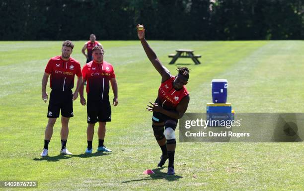 Maro Itoje bowls the ball as the team warm up playing a game of cricket prior to the Saracens training session ahead of the Gallagher Premiership...