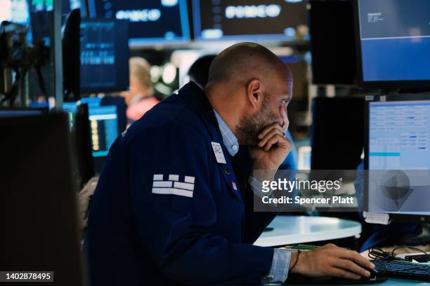 Traders work on the floor of the New York Stock Exchange on June 14, 2022 in New York City. The Dow was up in morning trading following a drop on...