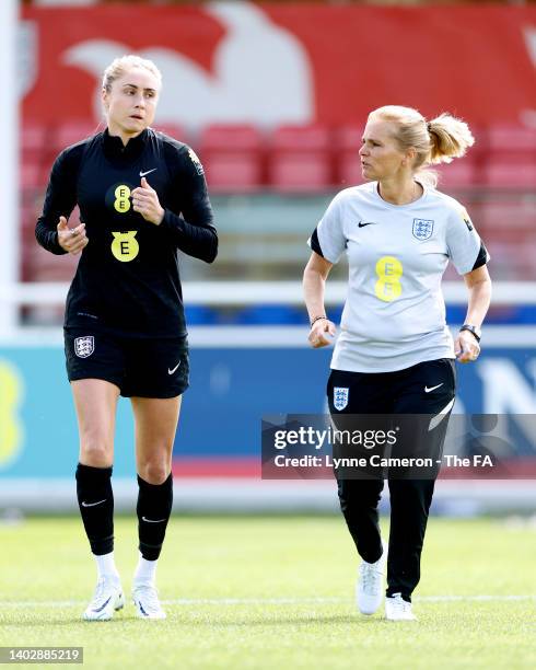 Steph Houghton of England trains with Sarina Wiegman, Manager of England during England Women Pre-Euro Camp 3 at St George's Park on June 14, 2022 in...