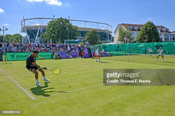 Felix Auger-Aliassime of Canada and Daniil Medvedev of Russia play their doubles match against Marcel Granollers of Spain and Horacio Zeballos of...