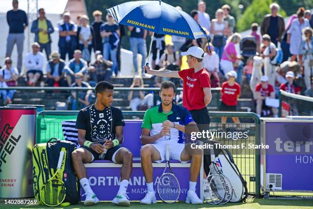 Felix Auger-Aliassime of Canada and Daniil Medvedev of Russia play their doubles match against Marcel Granollers of Spain and Horacio Zeballos of...