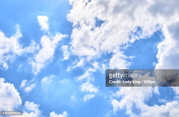 low angle view of clouds in sky - 背景 stock-fotos und bilder