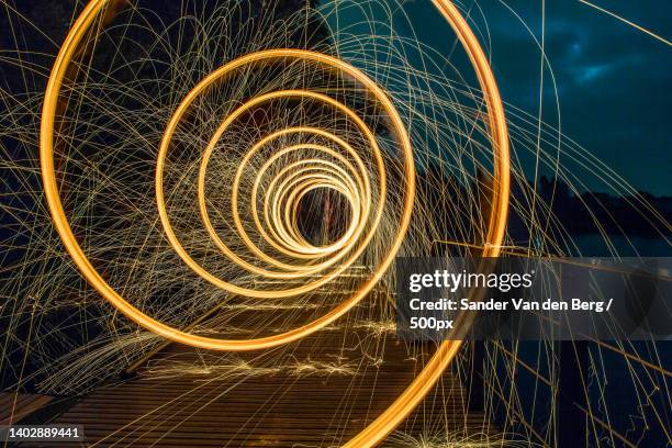 close-up of wire wool against sky at night - light trail nature stock pictures, royalty-free photos & images