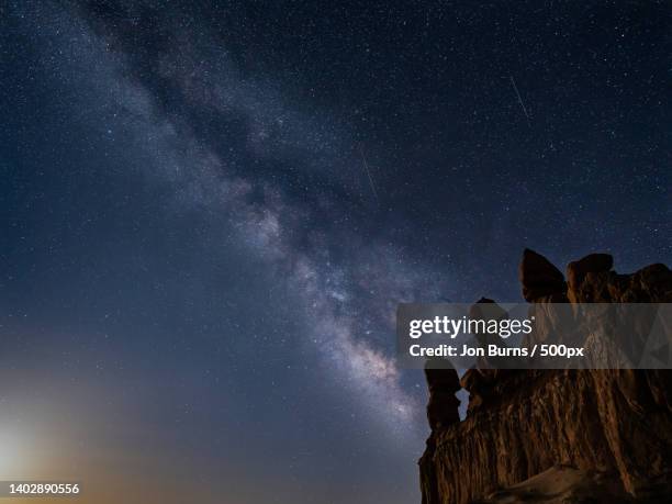 low angle view of rock formation against sky at night,goblin valley state park,united states,usa - goblin valley state park stock pictures, royalty-free photos & images