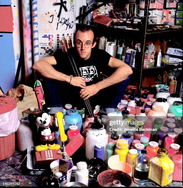 American artist Keith Haring holding outsize paintbrushes in his studio, New York City, 1985.