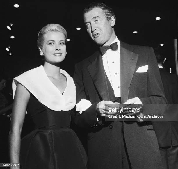 American actress Grace Kelly with 'Rear Window' co-star James Stewart, at the Hollywood premiere of the film, 10th August 1954.