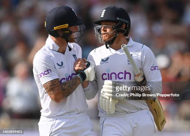Jonny Bairstow of England leaves the field and is congratulated by Ben Stokes after scoring 136 runs during the fifth day of the second Test between...