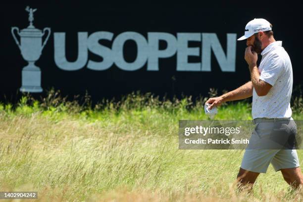 Dustin Johnson of the United States walks the 11th hole during a practice round prior to the US Open at The Country Club on June 14, 2022 in...