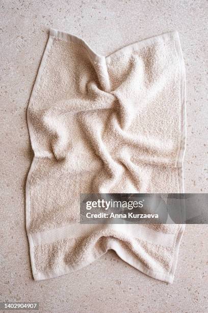 close-up of folded bath towel on concrete background, top view - towel imagens e fotografias de stock