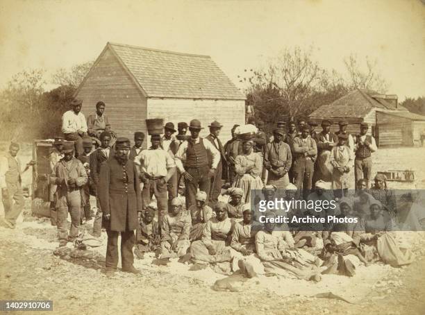 View of people, who are enslaved, and soldiers on the plantation of Confederate General Thomas Drayton in 1862 in Hilton Head, South Carolina.
