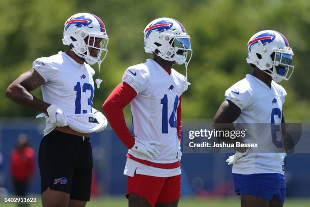 Gabriel Davis, Stefon Diggs, and Isaiah McKenzie of the Buffalo Bills stand during Bills mini camp on June 14, 2022 in Orchard Park, New York.