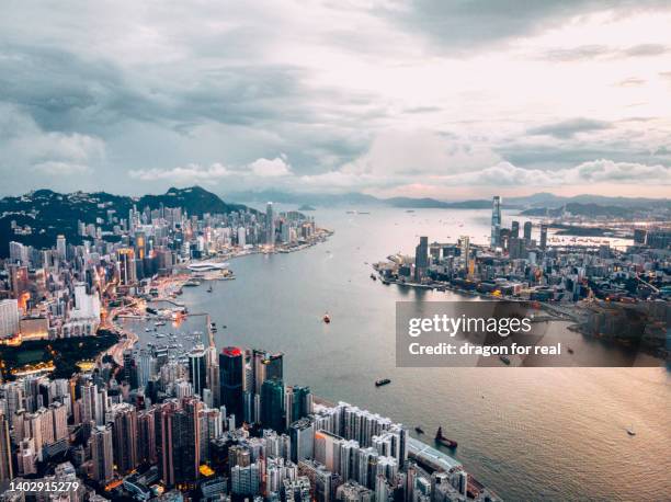 hong kong island shore line landscape in drone view - victoria harbour hong kong stock-fotos und bilder