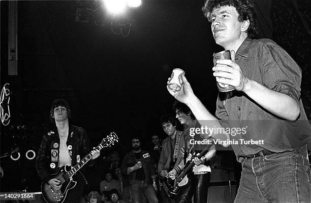 Tom Robinson from The Tom Robinson Band and Jake Burns from Stiff Little Fingers perform live on stage at the finale of the Rock Against Racism Red...