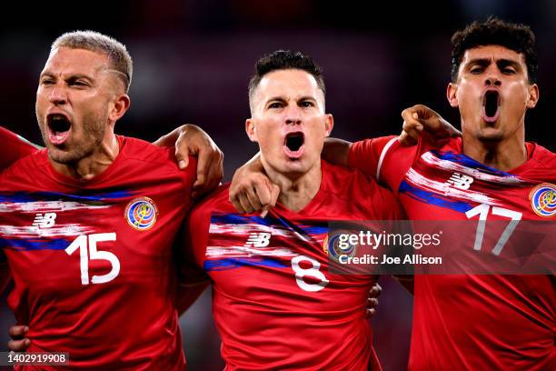 Francisco Calvo, Bryan Oviedo and Yeltsin Tejeda of Costa Rica sing their national anthem ahead of the 2022 FIFA World Cup Playoff match between...