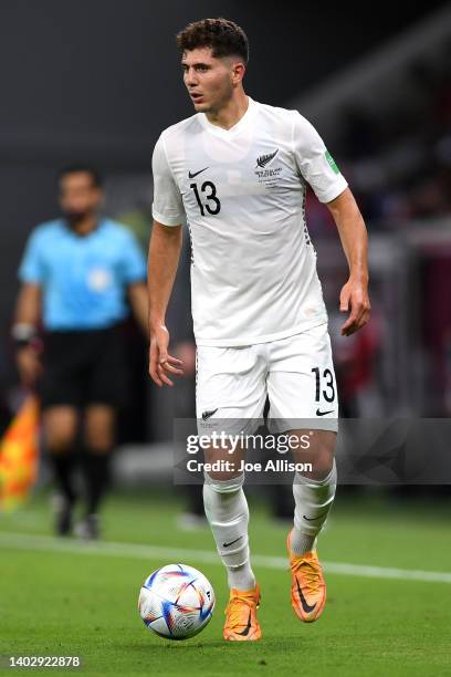 Liberato Cacace of New Zealand makes a run with the ball in the 2022 FIFA World Cup Playoff match between Costa Rica and New Zealand at Ahmad Bin Ali...