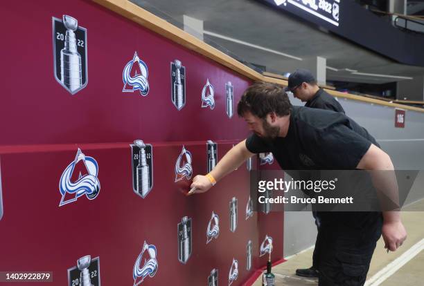An arena worker prepares the rink for Game One between the Colorado Avalanche and the Tampa Bay Lightning during the 2022 NHL Stanley Cup Final Media...