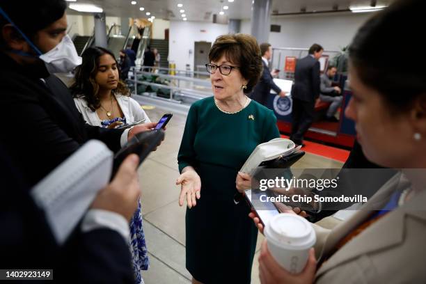 Sen. Susan Collins talks with reporters as she walks through the Senate subway following the weekly Senate Republican policy luncheon at the U.S....