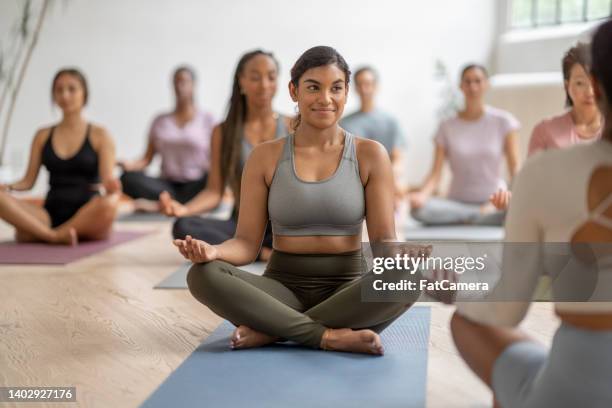 group meditation class - workplace wellbeing stock pictures, royalty-free photos & images