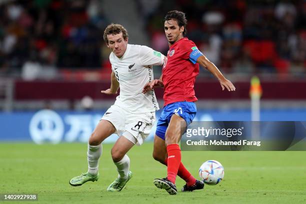 Joe Bell of New Zealand battles for possession with Bryan Ruiz of Costa Rica during the 2022 FIFA World Cup Playoff match between Costa Rica and New...