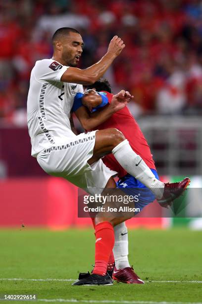 Bryan Ruiz of Costa Rica collides with Winston Reid of New Zealand in the 2022 FIFA World Cup Playoff match between Costa Rica and New Zealand at...