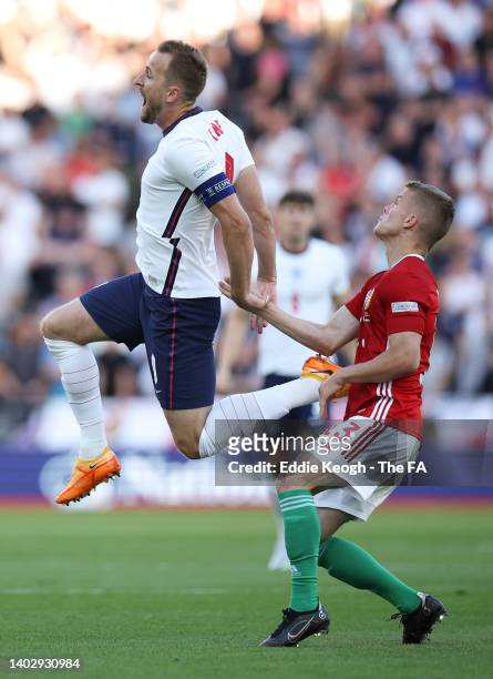 Harry Kane of England is challenged by Szabolcs Schoen of Hungary during the UEFA Nations League League A Group 3 match between England and Hungary...