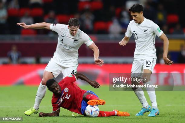 Joel Campbell of Costa Rica is challenged by Nando Pijnaker and Marko Stamenic of New Zealand during the 2022 FIFA World Cup Playoff match between...