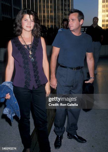 Daphne Zuniga and date at the Premiere of 'Sex, Lies and Video Tape', Cineplex Odeon Cinema, Century City.