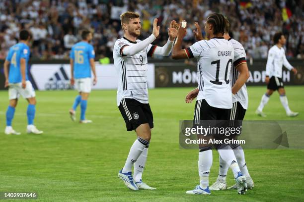 Timo Werner of Germany celebrates scoring their side's fourth goal with teammates during the UEFA Nations League - League A Group 3 match between...