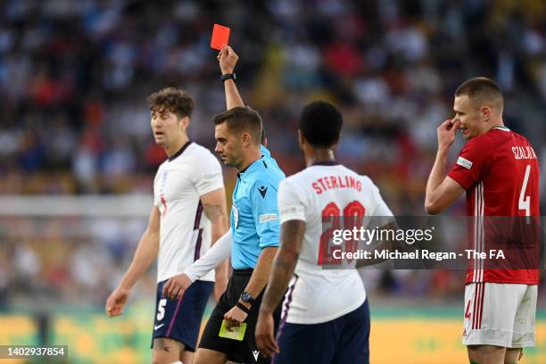 Referee Clement Turpin shows a red card to John Stones of England during the UEFA Nations League - League A Group 3 match between England and Hungary...