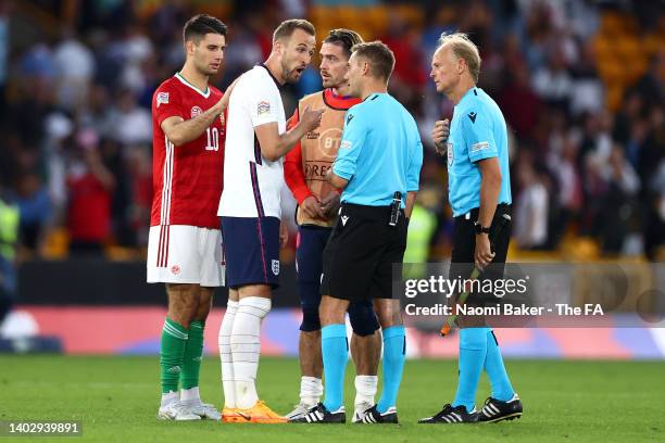 Harry Kane of England speaks to referee Clement Turpin after their sides defeat during the UEFA Nations League - League A Group 3 match between...