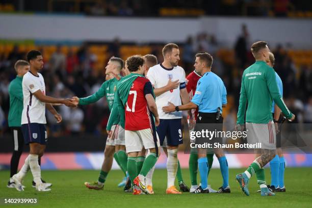 Harry Kane of England speaks to referee Clement Turpin after their sides defeat during the UEFA Nations League - League A Group 3 match between...