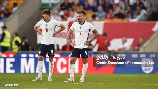 John Stones and Kalvin Phillips of England look dejected after they concede a third goal during the UEFA Nations League League A Group 3 match...