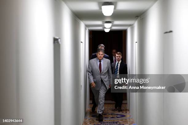 Sen. Joe Manchin walks through the U.S. Capitol Building as he goes to a luncheon with Senate Democrats on June 14, 2022 in Washington, DC. Senate...