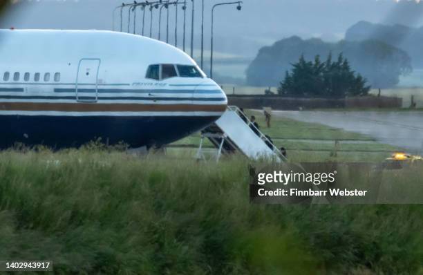 People are seen boarding the Rwanda deportation flight EC-LZO Boeing 767 at Boscombe Down Air Base, on June 14, 2022 in Boscombe Down. The Court of...