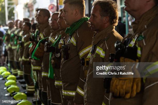 Fire Fighters are honoured and applauded as protestors take part in the 5th annual Silent Walk at Grenfell Tower on June 14, 2022 in London, England....