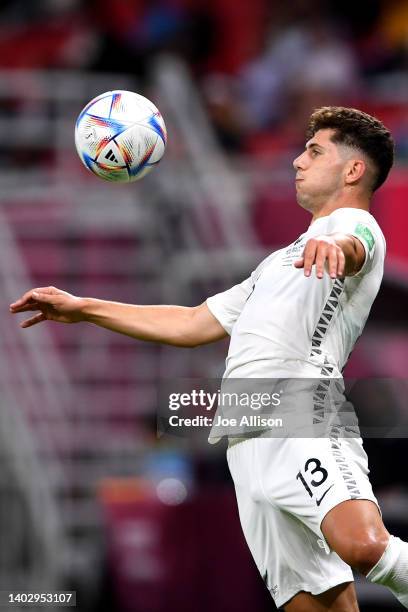 Liberato Cacace of New Zealand controls the ball in the 2022 FIFA World Cup Playoff match between Costa Rica and New Zealand at Ahmad Bin Ali Stadium...