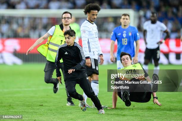 Streaker running at the pitch next to Leroy Sane of Germany during the UEFA Nations League League A Group 3 match between Germany and England at...