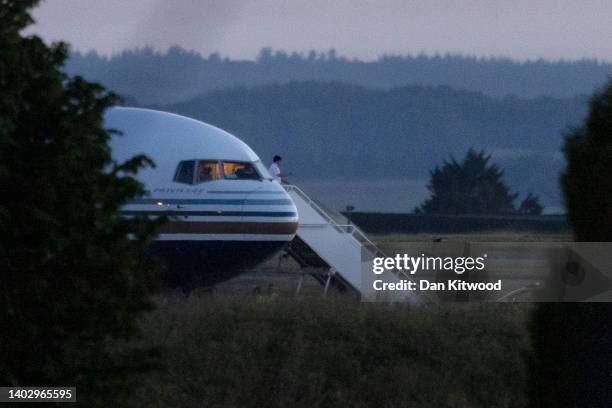 Pilot gestures from the grounded Rwanda deportation flight EC-LZO Boeing 767 at Boscombe Down Air Base, on June 14, 2022 in Boscombe Down near...