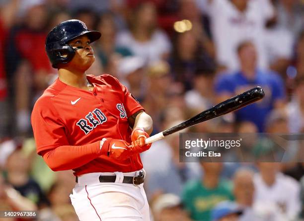 Rafael Devers of the Boston Red Sox watches his three run home run in the fourth inning inning against the Oakland Athletics at Fenway Park on June...