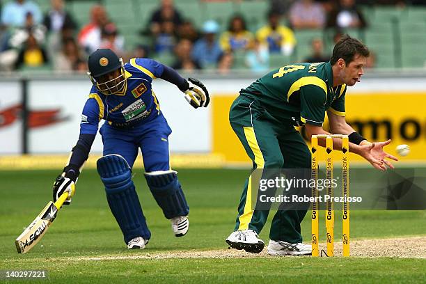 Daniel Christian of Australia attempts to run out Rengana Herath of Sri Lanka during the One Day International match between Australia and Sri Lanka...